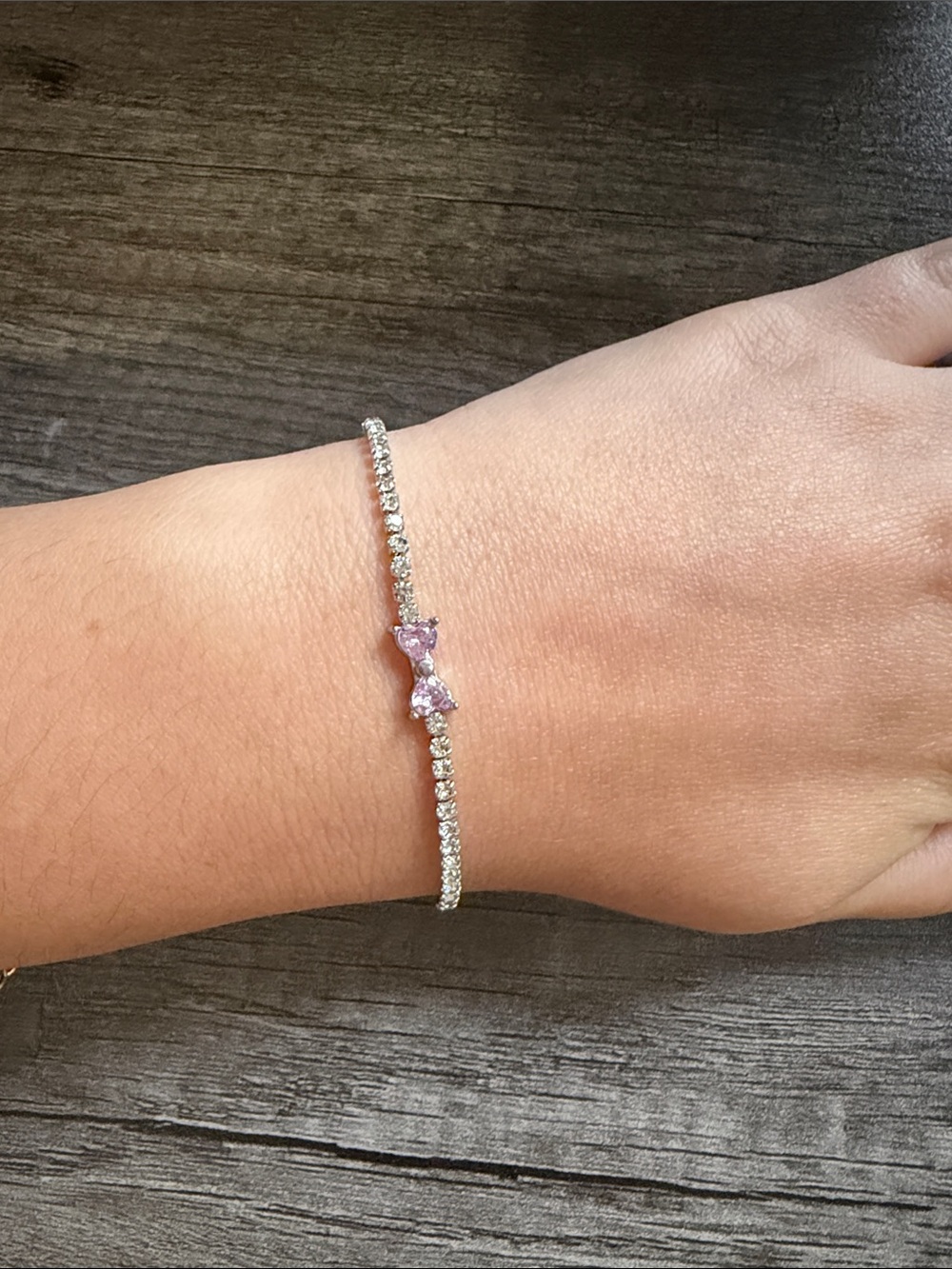 Tennis bracelet with pink bow